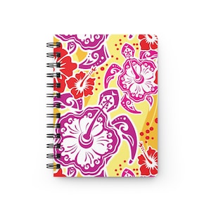 May include: A yellow spiral notebook with a tropical design featuring pink and white hibiscus flowers and pink sea turtles. The background is a yellow color with red dots.