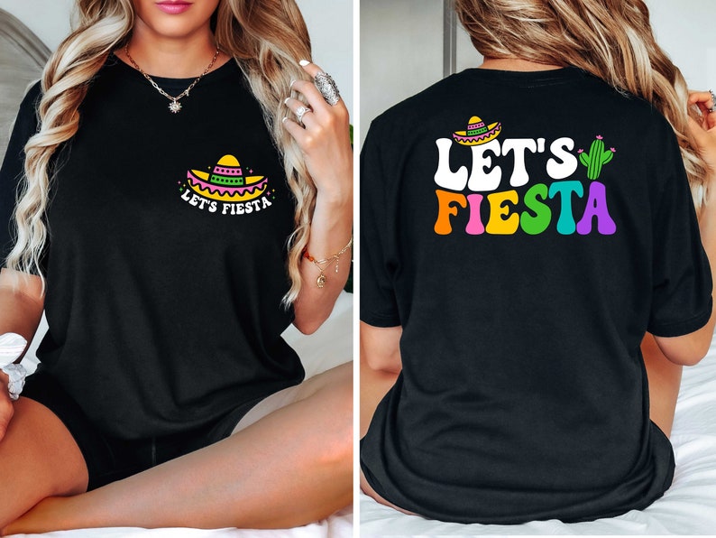 May include: Black t-shirt with a colorful "Let's Fiesta" graphic on the front and back. The front graphic features a sombrero and the back graphic features a cactus.