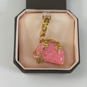 O04-Juicy Couture rosa Taschenanhänger