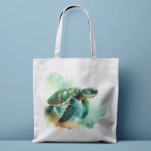 May include: A white tote bag with a watercolor illustration of a sea turtle swimming in the ocean. The turtle is green and blue with a brown shell. The background is a light blue and green watercolor wash.