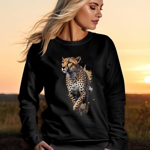May include: Black sweatshirt with a cheetah print design. The cheetah is running and has a watercolor effect around it.
