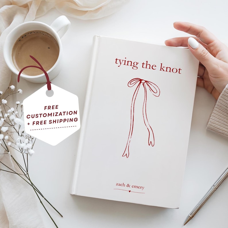 white and red personalized coquette engagement journal with bow tying the knot engagement party gift for bride