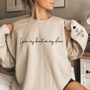 Custom I Wear My Heart On My Sleeve Sweatshirt, Personalized Mom Hoodie With Kids Names On Sleeve, Cute Mommy Outfit, Happy Mothers Day Gift