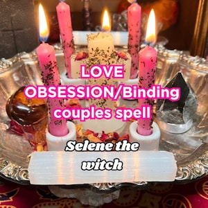 May include: A silver tray with six pink candles, a white candle, a clear crystal, and a brown stone. The candles are lit and the tray is surrounded by rose petals. The text "LOVE OBSESSION/Binding couples spell Selene the witch" is written on the tray.