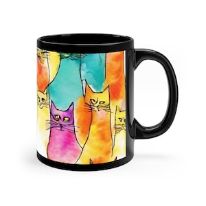 Coffee mug with cats. Yellow/black coffee mug with cats.