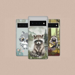 May include: Three phone cases with different designs featuring raccoons. The first case has a cartoon raccoon with a light blue background. The second case has a realistic raccoon with a watercolor background. The third case has a raccoon playing a guitar with a forest background.
