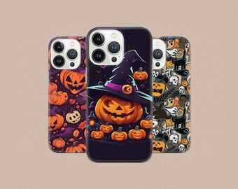 May include: Three Halloween-themed iPhone cases. The first case features a black background with a pumpkin and a witch's hat. The second case has a black background with a pumpkin and a witch's hat. The third case has a black and white background with a variety of Halloween-themed images.