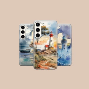 May include: Three phone cases with watercolor designs featuring lighthouses, seascapes, and boats. The cases are clear and show the phone's camera lenses.