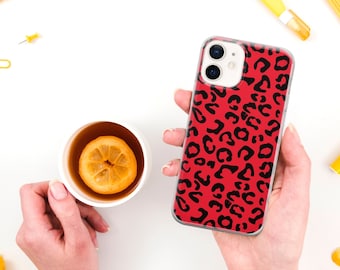 May include: A red and black leopard print phone case for an iPhone.