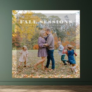 May include: A family of four poses for a fall photo shoot. The parents are holding each other, while the two children run around in the background. The image is captioned "Fall Sessions" with the text "Yoga Studio Photography" below.