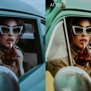 May include: A woman in a vintage car applies lipstick while wearing white cat-eye sunglasses and a brown scarf. The car is green and has a chrome mirror.