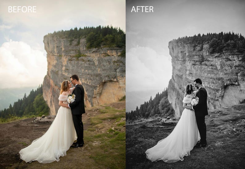 May include: A bride and groom are kissing in front of a large cliff. The bride is wearing a white wedding dress and the groom is wearing a black suit. The couple is standing on a grassy hilltop with a view of a forest in the background.