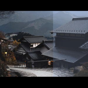 Puede incluir: Una vista panor&aacute;mica de casas tradicionales japonesas con tejados oscuros de tejas y paredes de color claro. Las casas est&aacute;n ubicadas en un valle con monta&ntilde;as al fondo, creando un paisaje sereno y pintoresco. La imagen fue tomada durante el d&iacute;a, con un cielo ligeramente nublado.