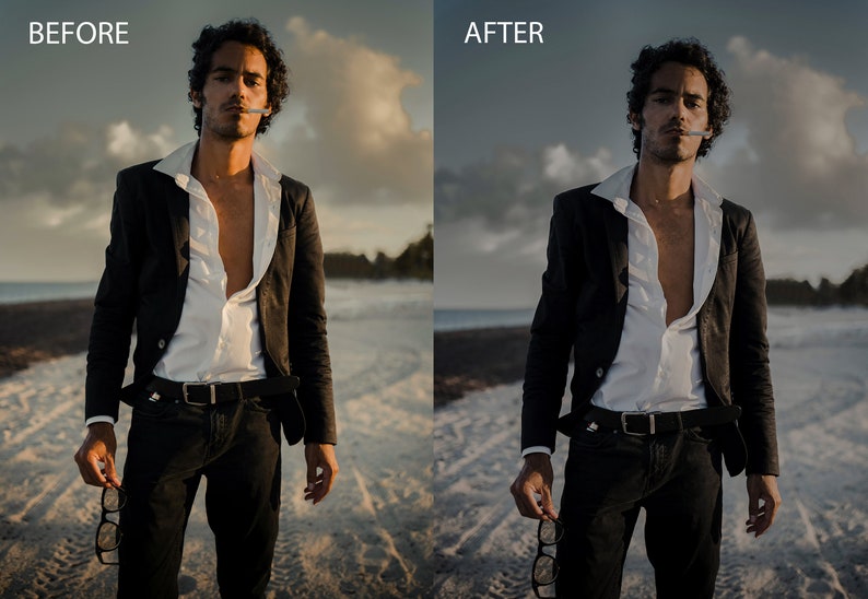 May include: A man in a black suit jacket and white shirt stands on a beach with a cigarette in his mouth. He is holding a pair of glasses in his hand.