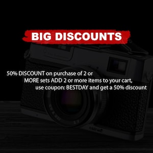 May include: A vintage camera with a black leather body and a silver lens. The image has a red banner across the top that says "BIG DISCOUNTS". The text below the camera says "50% DISCOUNT on purchase of 2 or MORE sets ADD 2 or more items to your cart, use coupon: BESTDAY and get a 50% discount"