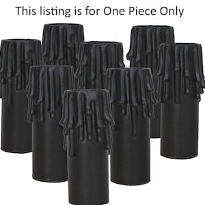 May include: Eight black candle pillar drip covers. The covers have a textured, drippy design.