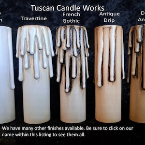 May include: Five candle sleeves with different finishes: Ivory Blush, Travertine, French Gothic, Antique Drip, and Dark Antique. The candle sleeves have a dripped wax design. The text "Tuscan Candle Works" is at the top.