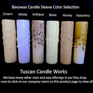 May include: Six beeswax candle sleeves in different colors: cream, white, antique, bone, honey, and palomino. The sleeves are dripped with wax, creating a rustic look. Beeswax Candle Sleeve Color Selection. Tuscan Candle Works.