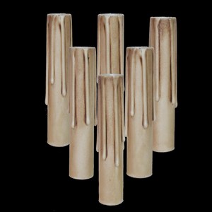 May include: Six beige taper candles with dripped wax, perfect for adding a rustic touch to your home decor.