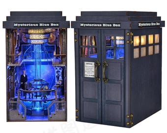 May include: A detailed, blue wooden box with the text "Mysterious Blue Box" on top. The box has a door with a handle and a sign that reads "Notice". The interior is lit with blue and yellow lights, showcasing a detailed interior scene.