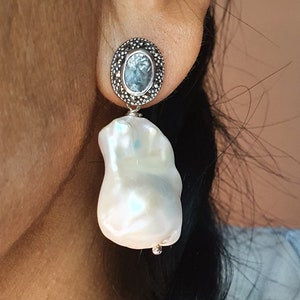 Stunning earrings in 925% nickel free silver, with wonderful baroque pearls, blue topaz, and Marcassite (EA6 BT.)