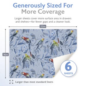 May include: Drawer liner with a blue and white botanical design featuring parrots. The liner measures 56 cm wide by 41 cm high and comes in a pack of 6 sheets. The text on the liner reads "Generously Sized For More Coverage."