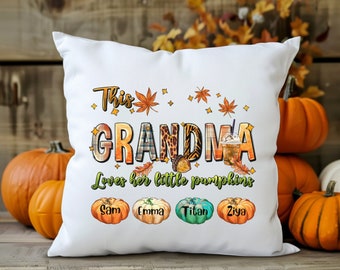May include: White throw pillow with the text "This Grandma Loves her little pumpkins" with four pumpkins with the names Sam, Emma, Titan, and Ziya.