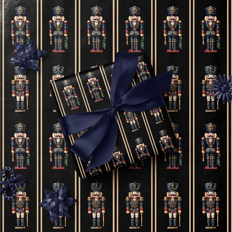 May include: A wrapped gift with a navy blue bow sits on a black background with vertical white stripes. The wrapping paper features a repeating pattern of toy nutcracker soldiers in blue, red, and gold. Decorative navy blue accents are scattered around the gift.