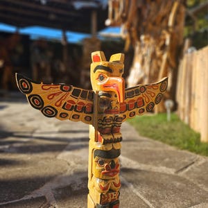 May include: A set of three ceramic nesting bowls in shades of blue, green, and white. The bowls feature a speckled glaze and a simple, modern design. The largest bowl measures approximately 6 inches in diameter.