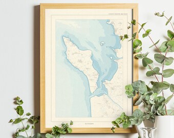 May include: A framed map print with a light blue and beige color scheme hangs above a collection of potted cacti, a vintage camera, and a glass jar. Eucalyptus sprigs are arranged in white vases, creating a natural, decorative display.