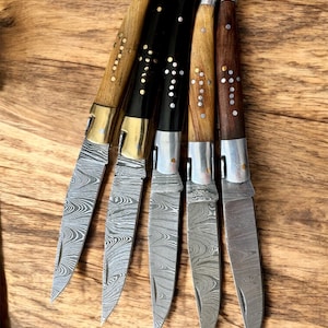 Couteau Laguiole fait main en acier damas : manche en palissandre, étui en cuir