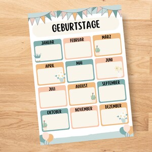 May include: A printable birthday calendar with a light blue background and colorful flags at the top. The calendar is divided into 12 months, each with a space to write names. The months are labeled in German: Januar, Februar, M&auml;rz, April, Mai, Juni, Juli, August, September, Oktober, November, Dezember.