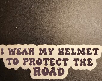 I Wear My Helmet To Protect The Road. Sticker.