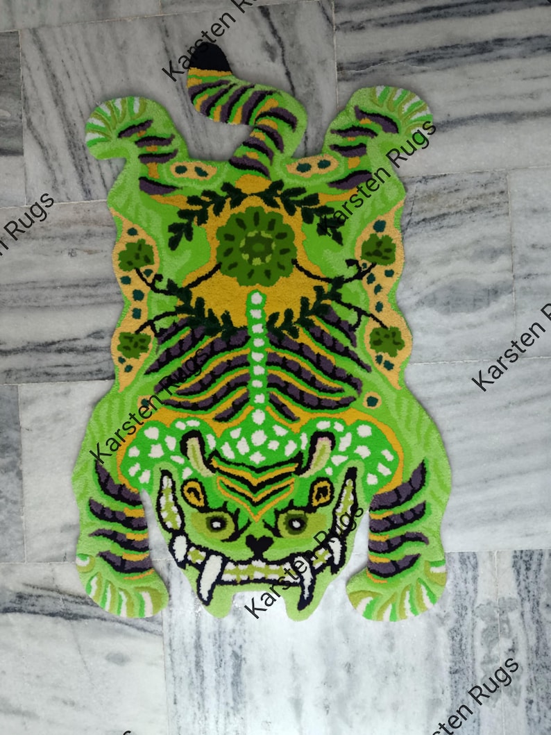 May include: Green and yellow tiger rug with a floral design on the back. The rug is made of a soft, plush material and is perfect for adding a touch of whimsy to any room.