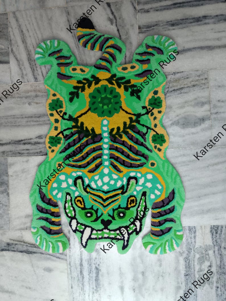 May include: Green and yellow tiger rug with a floral design in the center. The rug is made of a soft, plush material and is perfect for adding a touch of whimsy to any room.