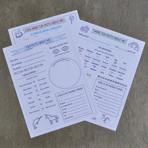 May include: Three white fill-in-the-blank sheets with black line art. The sheets have prompts for fun facts, including name, birthday, and favorite things. One sheet has the text "EVEN MORE FUN FACTS ABOUT ME!"