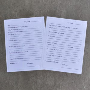 May include: Two white fill-in-the-blank letter sheets with lined spaces for writing. The sheets have prompts such as "How are things there?" and "I miss you so much." The text "Today's Date" and "Your Penpal" are also visible.