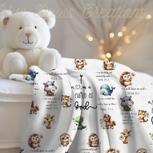 May include: White baby blanket with a repeating pattern of cute animal illustrations. The animals include a hippopotamus, a tiger, a giraffe, a dinosaur, a whale, a hedgehog, and an owl. The blanket features the text "I am a child of God" and several bible verses.