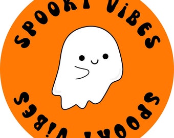 May include: Orange circle with the text "Spooky Vibes" written around the edge in black. A white ghost with a smiling face is in the center of the circle. The text "Spooky Vibes" is repeated in reverse on the bottom half of the circle.