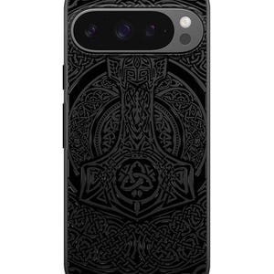 May include: Black phone case with a detailed design of a hammer and intricate knotwork.