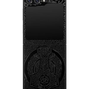 May include: Black phone case with a detailed design of a hammer and Celtic knotwork.