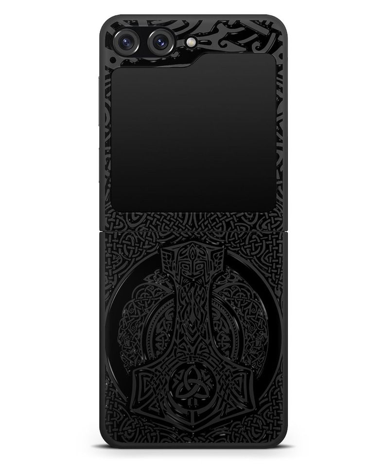 May include: Black phone case with a detailed design of a hammer and Celtic knotwork.