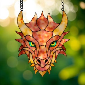May include: Stained glass dragon head with orange, yellow, and red hues. The dragon has green eyes and is suspended by a black chain. The design features intricate details and sharp edges, perfect for fantasy decor.