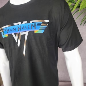 May include: Black t-shirt with a silver and blue graphic of the band Van Halen's logo.