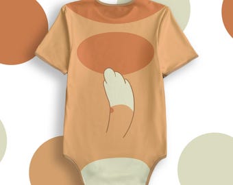 May include: A light brown baby onesie with a cartoon cat tail and paw print on the back. The onesie has short sleeves and a snap closure.