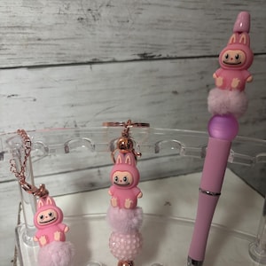 labubu pens, keychains, and Stanley charms