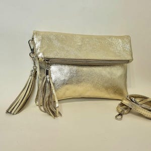 Bolso de mano de piel auténtica metalizado dorado: bolso de noche plegable