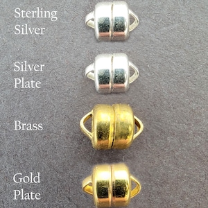 May include: Four magnetic clasps in different finishes: sterling silver, silver plate, brass, and gold plate.