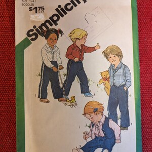 May include: Simplicity sewing pattern number 9885 for toddler clothing. The pattern includes three different outfits: a red and white striped shirt with blue trousers, a blue shirt with blue trousers, and a blue waistcoat with a white shirt and blue trousers. The pattern is priced at £1.75.