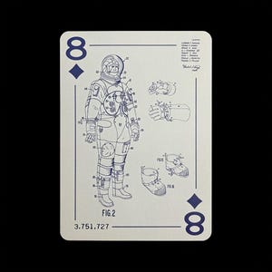 May include: Playing card featuring a blue diagram of an astronaut suit, labeled "FIG.2" and "3.751,727". The card is off-white with blue suit details, the number "8" and a diamond symbol in the corners.